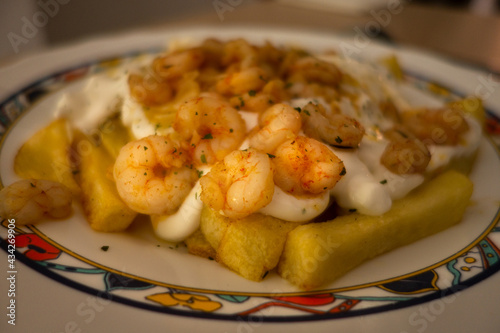 Spanish tapas of potatoes with shrimp and aioli. Mediterranean food