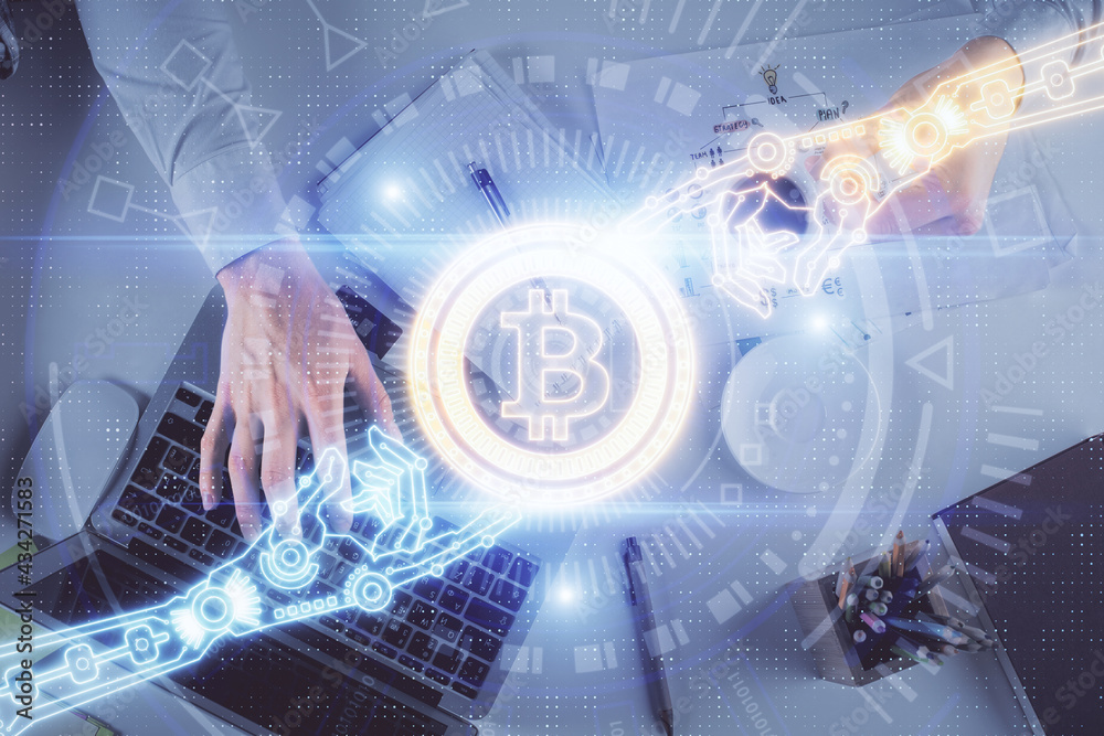 Double exposure of man's hands typing over computer keyboard and crypto currency theme hologram drawing. Top view. Blockchain concept. Double exposure of man's hands typing over computer keyboard and crypto currency theme hologram drawing. Top view. Blockchain concept.
