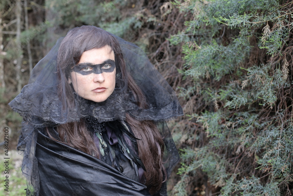 Spooky mysterious lady in the forest
