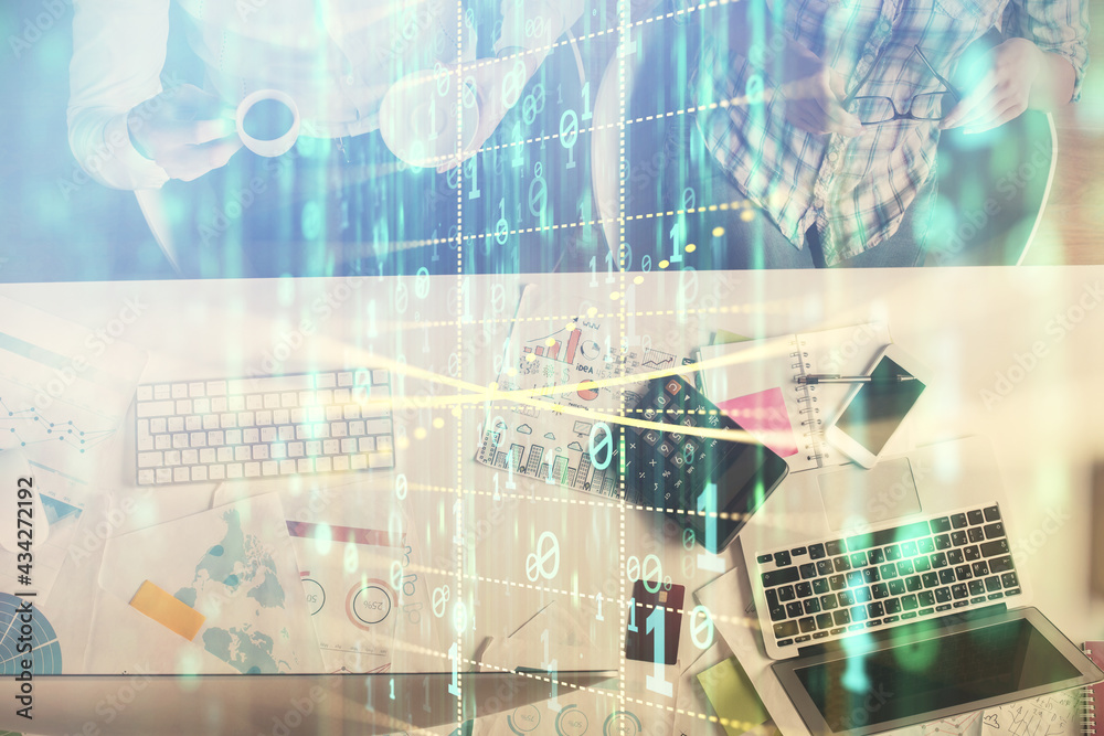 Double exposure of man and woman working together and data theme hologram drawing. Computer background. Top View. Double exposure of man and woman working together and data theme hologram drawing. Computer background. Top View.