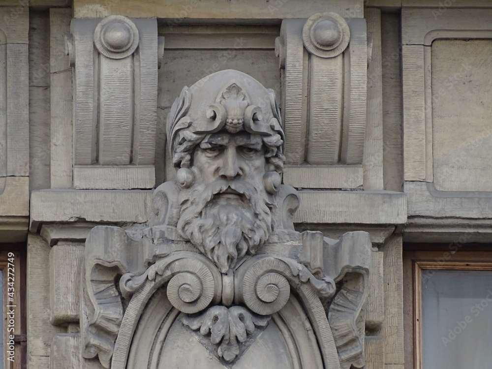 Fragment of the facade of a beautiful old building, architectural decor 