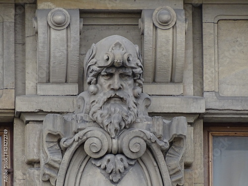 Fragment of the facade of a beautiful old building, architectural decor 