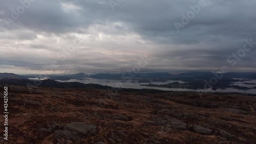 Leroyosen waters and Flesland Bergen airport in the background - Late night moody cloudy aerial close to ground photo