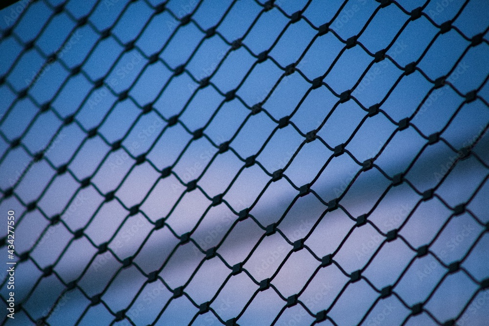 Fototapeta premium chain link fence with blue sky