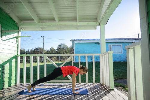 Fototapeta Naklejka Na Ścianę i Meble -  female yoga house porch, health sport activity spring girl