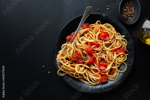 Tomato pasta with cheese on plate
