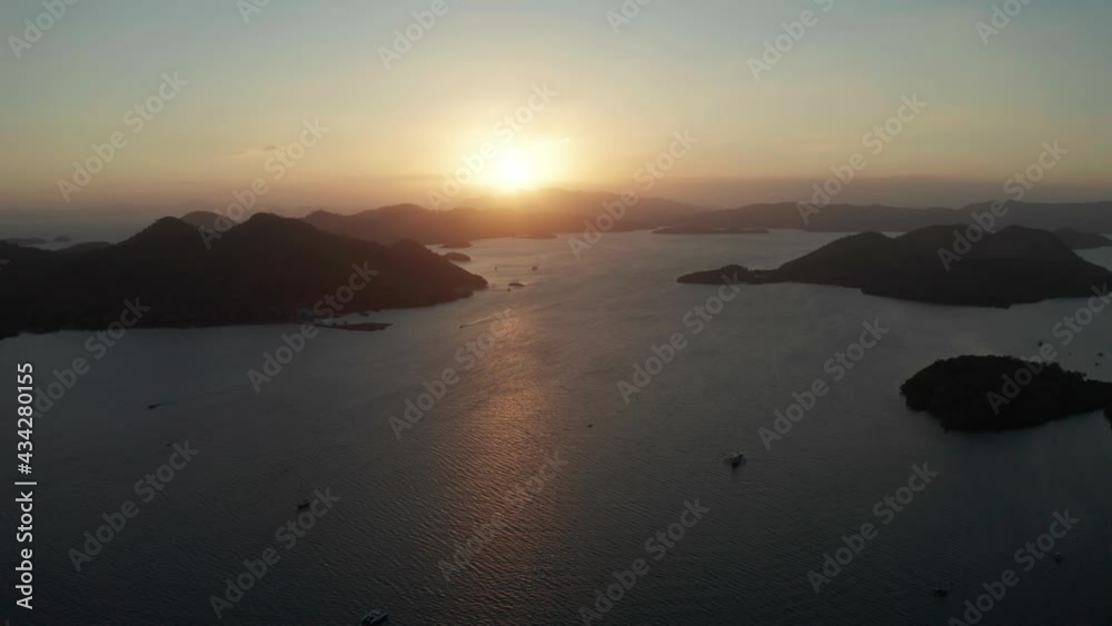 aerial view Sea bay with boats at sunset. Sunset over the sea with islands. Philippine Islands in the evening. Busuanga, Palawan, Philippines aerial view Sea bay with boats at sunset. Sunset over the sea with islands. Philippine Islands in the evening. Busuanga, Palawan, Philippines