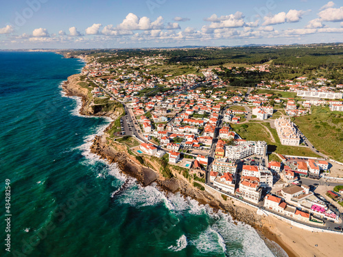 Schilderij op canvas Aerial view of Praia das Macas little township along south Portuguese coastline facing the Atlantic Ocean, Colares, Portugal