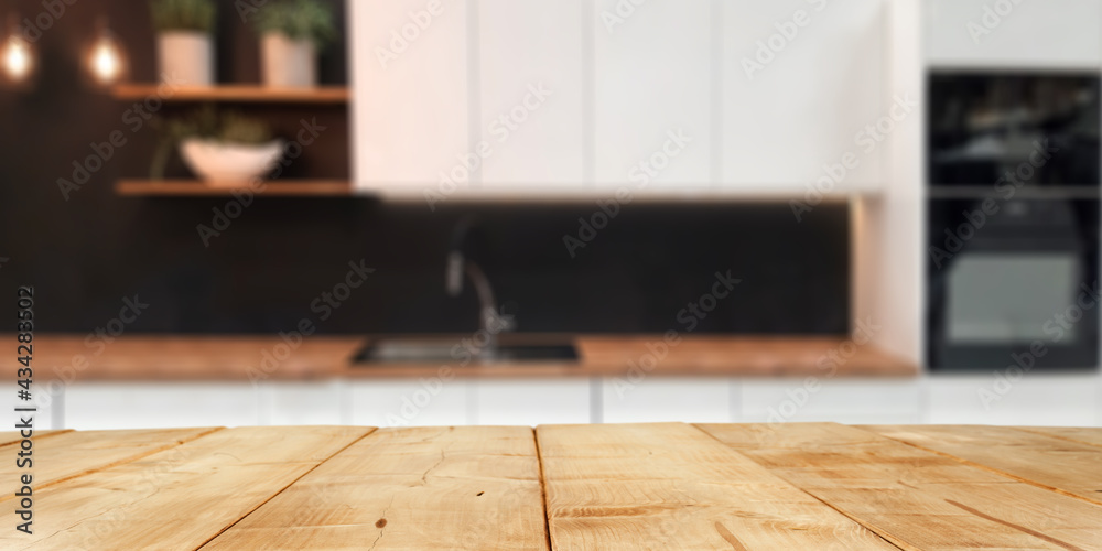 Wooden desk of free space and kitchen interior Wooden desk of free space and kitchen interior