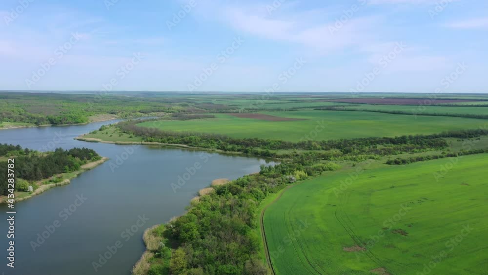 Agricultural fields near the reservoir. Spring time Aerial view Agricultural fields near the reservoir. Spring time Aerial view