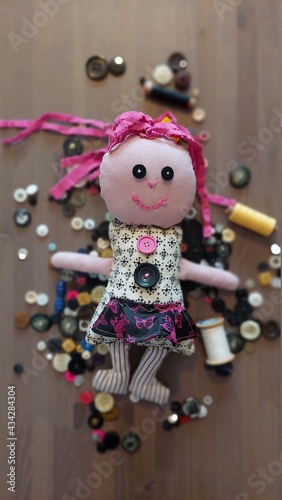 Rag doll, emotional rag doll, PATCH - LALLI.An emotional doll made of leftovers. He's got buttons instead of eyes. Soft, soft and very special. ON ONE SIDE HE SMILES FROM THE OTHER FROFROWNING. photo