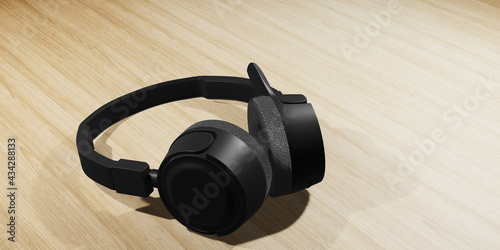 Black over-ear headphones on a wooden table. 3D illustration.
