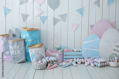 Photography Baskets with lot colorful Easter eggs and carrots! Spring home decoration and easter decor