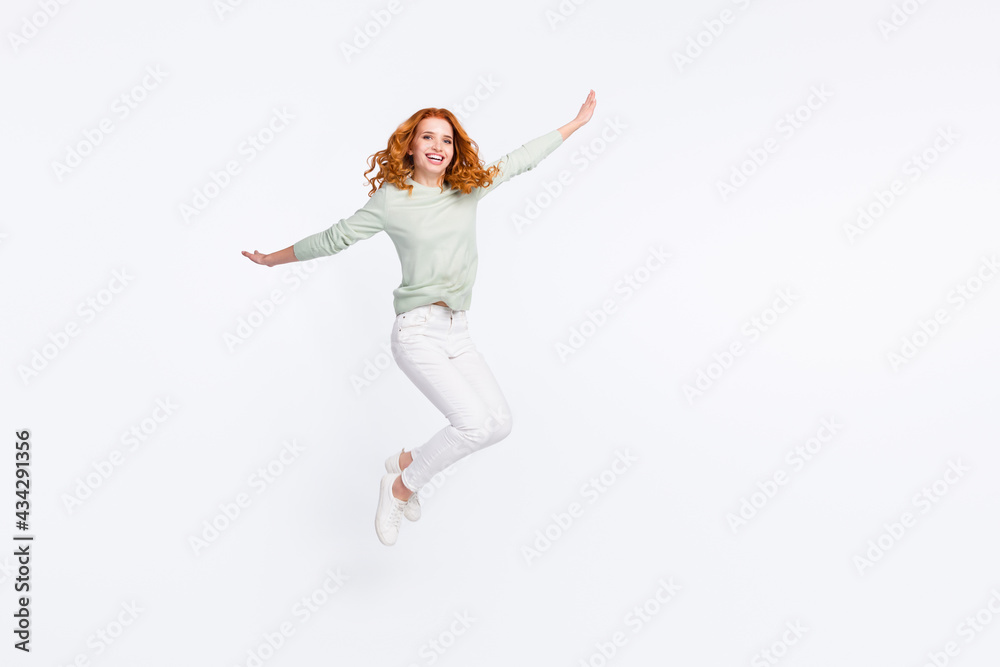 Full length body size photo young woman red hair jumping up playful careless childish isolated white color background
