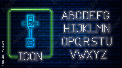 Glowing neon Electrical hand concrete mixer icon isolated on brick wall background. Handheld electric cement mixer. Neon light alphabet. Vector