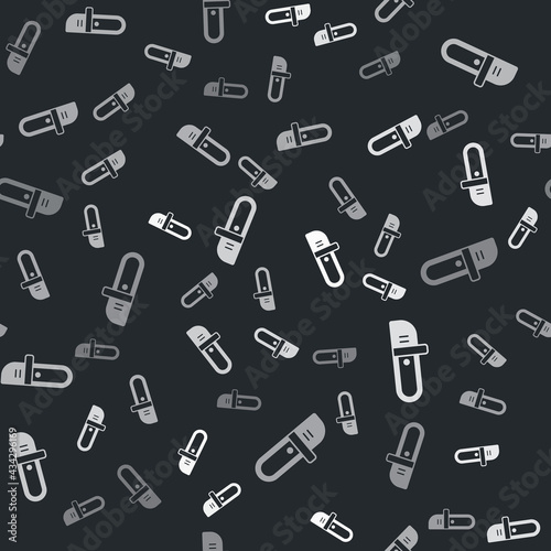 Grey Chainsaw icon isolated seamless pattern on black background. Vector