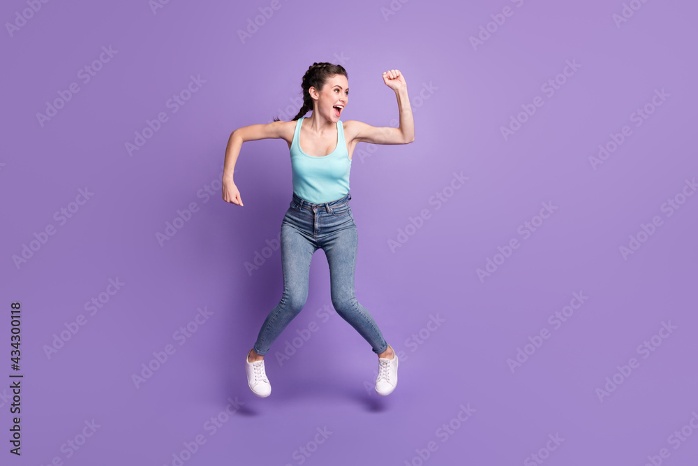Full length body size view of pretty cheerful comic girl jumping dancing rejoicing isolated over violet purple color background