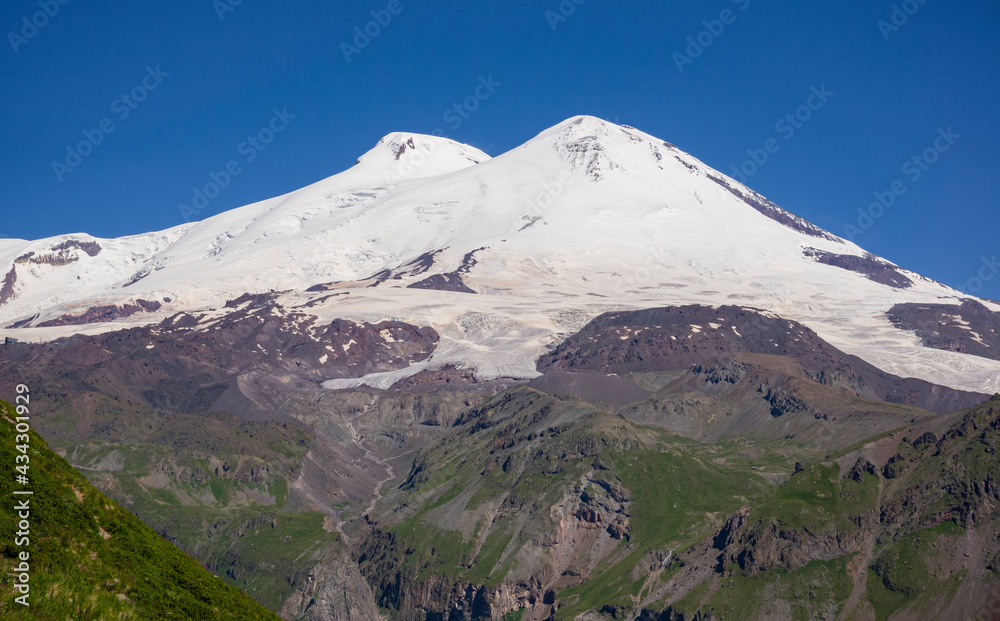 Mount Elbrus. Landscape view in the south-east of mount from Cheget mount. July. Kabardino-Balkaria region, Russia.