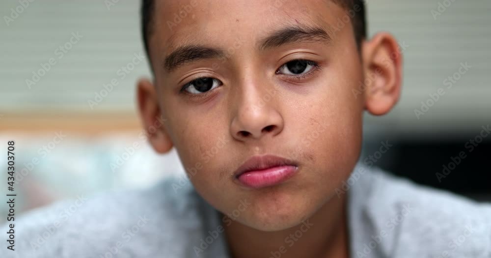 Hispanic little boy child portrait, no expression serious emotion