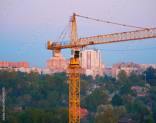 Construction crane during sunset time background photo