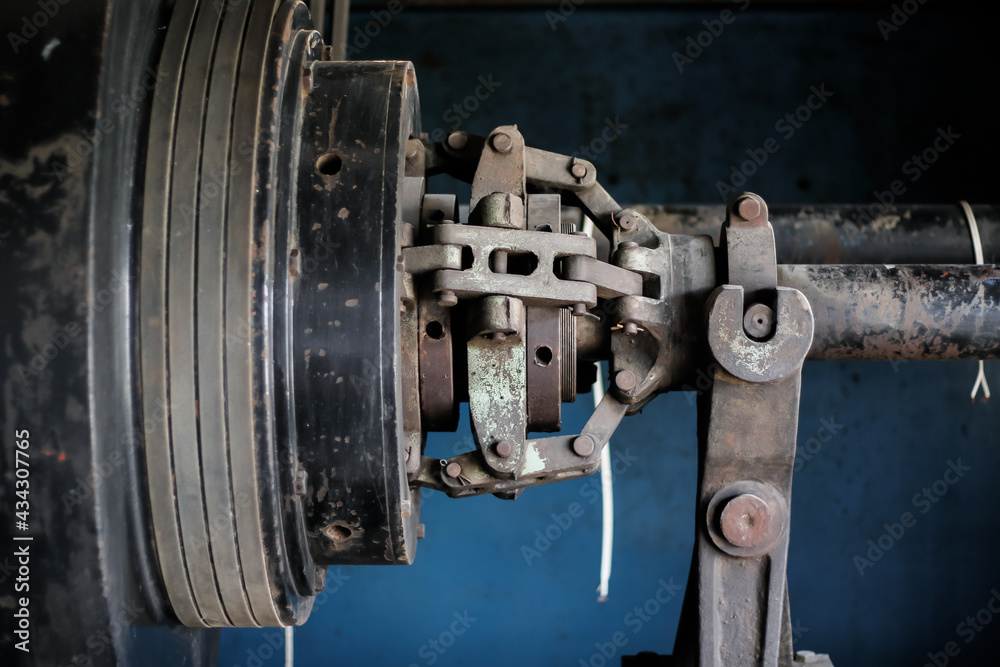 Rustic industrial ice can machine with blue background