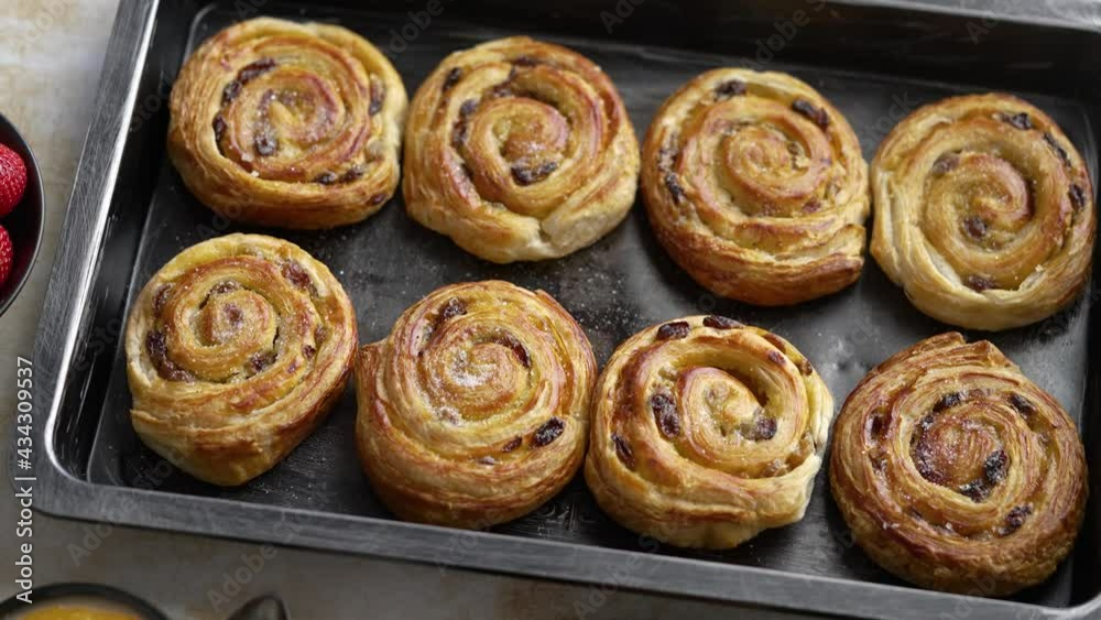 Freshly baked buns with cinnamon and spices. Close-up. Sweet baking concept Freshly baked buns with cinnamon and spices. Close-up. Sweet baking concept
