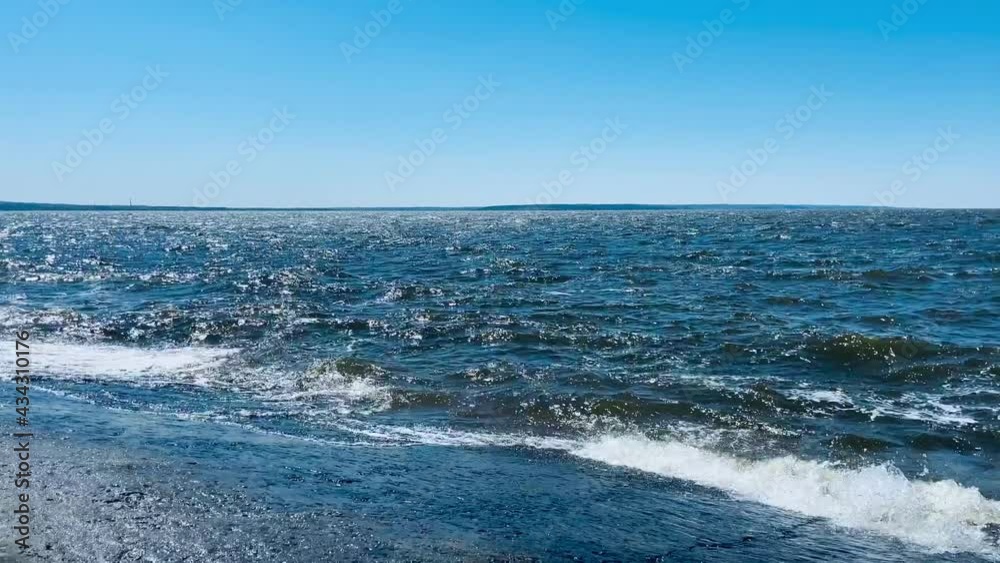 Waves hit a concrete slab on the shore. Waves hit a concrete slab on the shore.