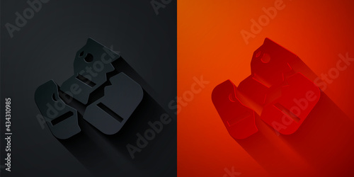 Paper cut Scissors cutting a credit card icon isolated on black and red background. Online payment. Cash withdrawal. Financial operations. Shopping sign. Paper art style. Vector