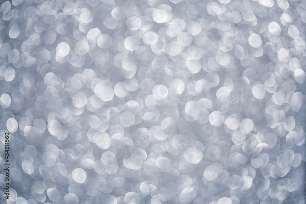 Abstract festive elegant gray background of blurred with bokeh lights and stars texture Abstract festive elegant gray background of blurred with bokeh lights and stars texture