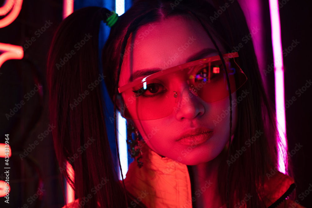 asian woman in sunglasses looking at camera, cyberpunk concept asian woman in sunglasses looking at camera, cyberpunk concept