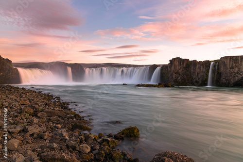 Beautiful waterfall under midnight light in summer. Godafoss waterfall  Iceland.