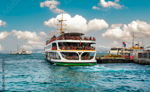 Wallpaper Mural Muslim architecture and water transport in Turkey - Beautiful View touristic landmarks from sea voyage on Bosphorus. Cityscape of Istanbul at sunset - old mosque and turkish steamboats, view on Golden Torontodigital.ca