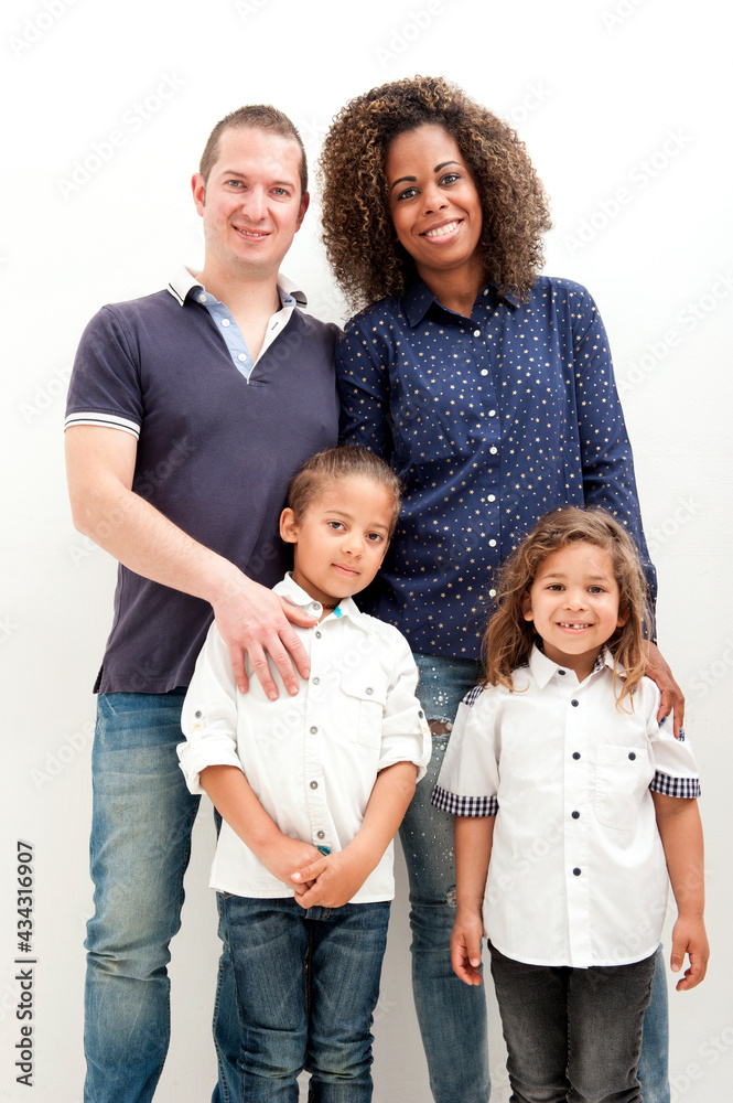 Happy multiracial family with two children, on the white background Happy multiracial family with two children, on the white background