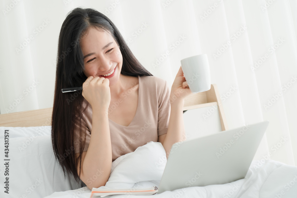 Portrait happy smiling woman in the bedroom Portrait happy smiling woman in the bedroom