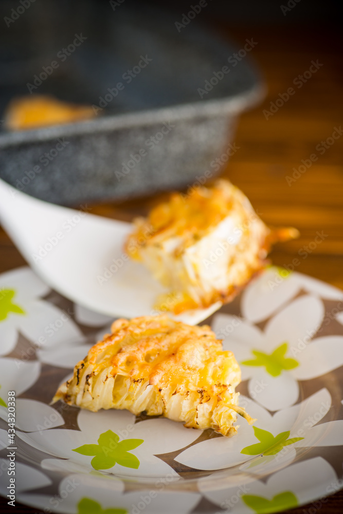 Fototapeta premium cabbage in batter baked with cheese in the plate