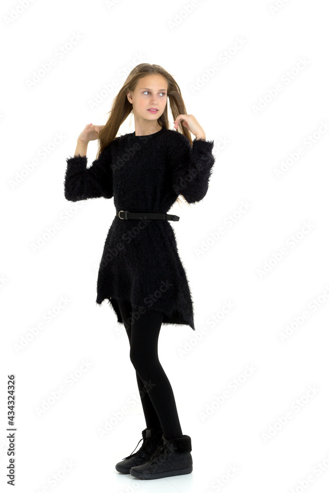 Pretty teenage long haired girl in black clothes