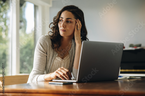 Fényképezés Stressed woman taking break from work at home
