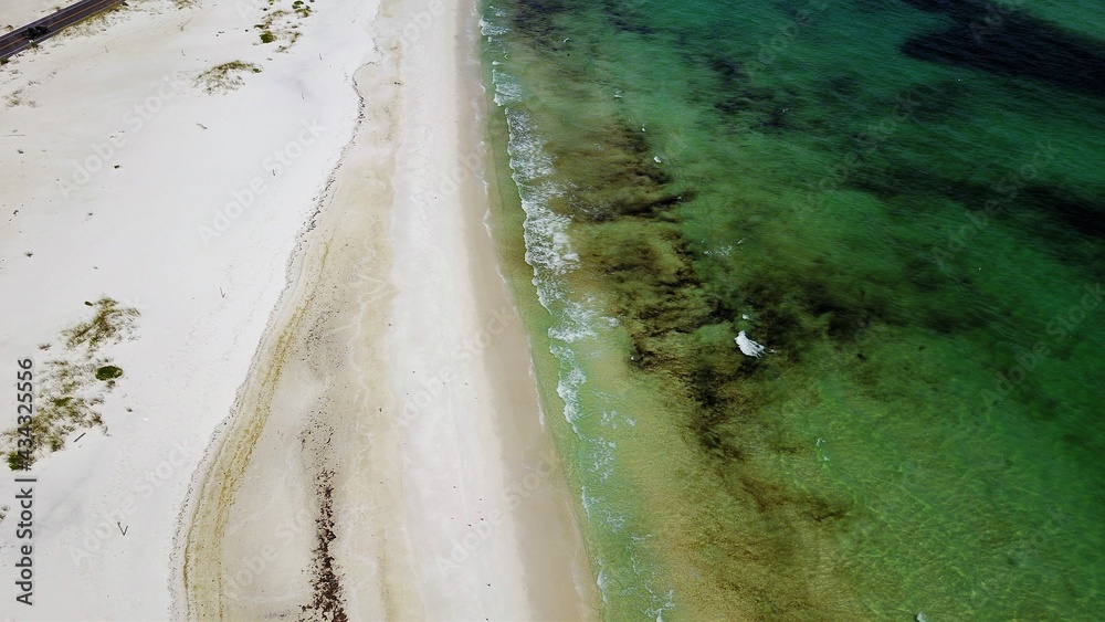 Aerial view of a white sand beach in florida