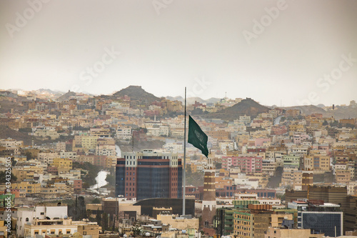 Down goes the Saudi Arabian National flag as the rain starts to shower