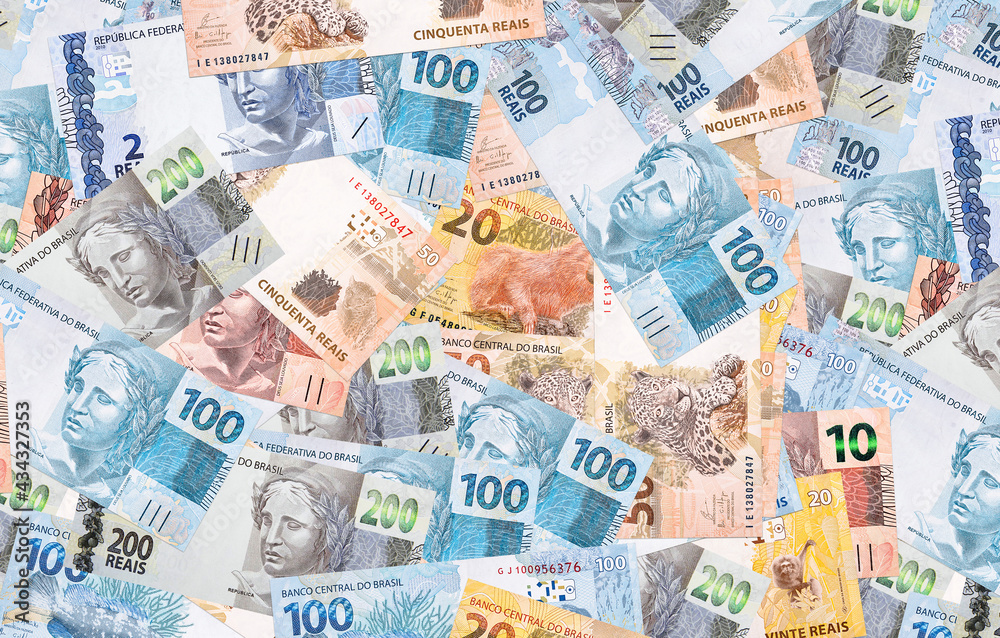 Brazilian reais, different money notes, 100, 50, 20 and 10 reais. Texture background, Brazilian economy concept