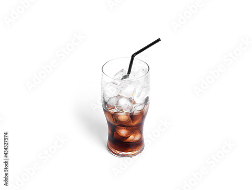 Soda with ice in a transparent glass isolated on a white background.