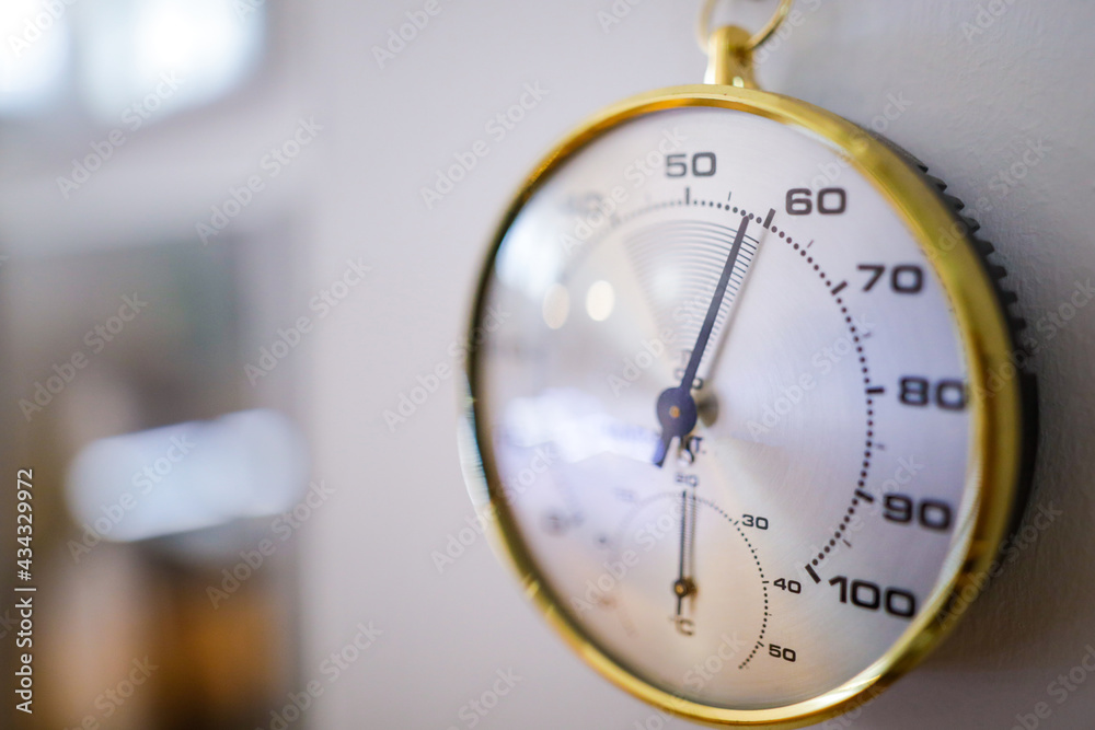 Shallow depth of field (selective focus) details with an analog hygrometer on the wall of a museum. - obrazy, fototapety, plakaty 