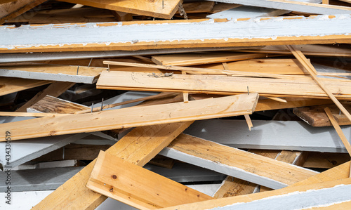 Pile of old wooden planks in a heap after a house is demolished.