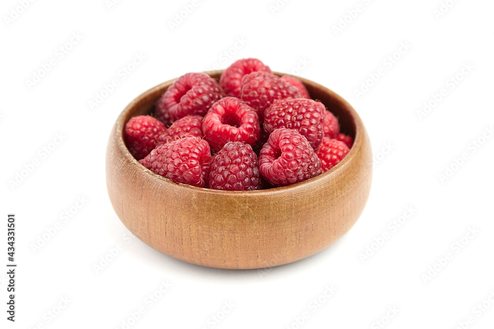 Fresh raspberries in wooden bowl isolated on white background. Red sweet raspberries Fresh raspberries in wooden bowl isolated on white background. Red sweet raspberries