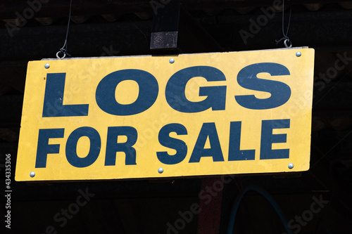 sign saying logs for sale