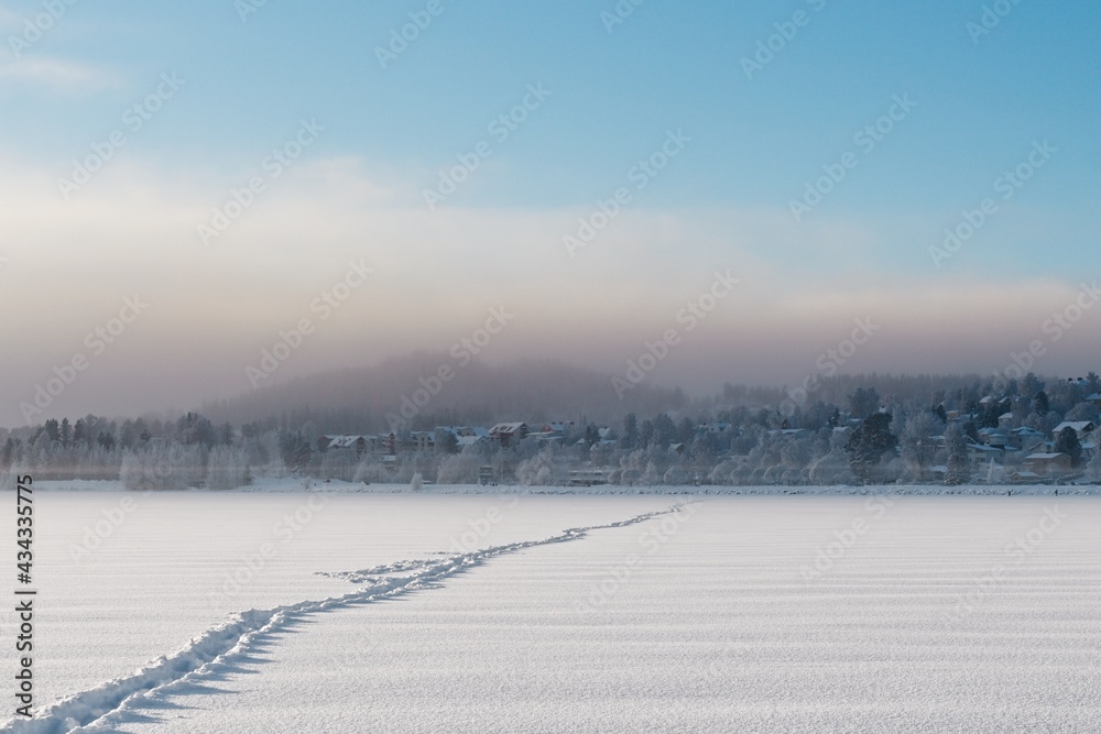 Path formed in the snow on the frozen lake Storsjön in Östersund