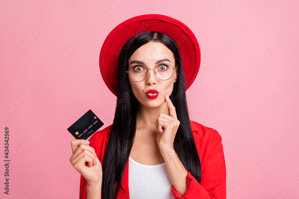 Naklejka premium Photo of young girl happy positive smile hold credit card pouted lips send air kiss isolated over pink color background