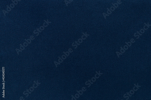 Texture of natural blue twill fabric close-up. background for your mockup