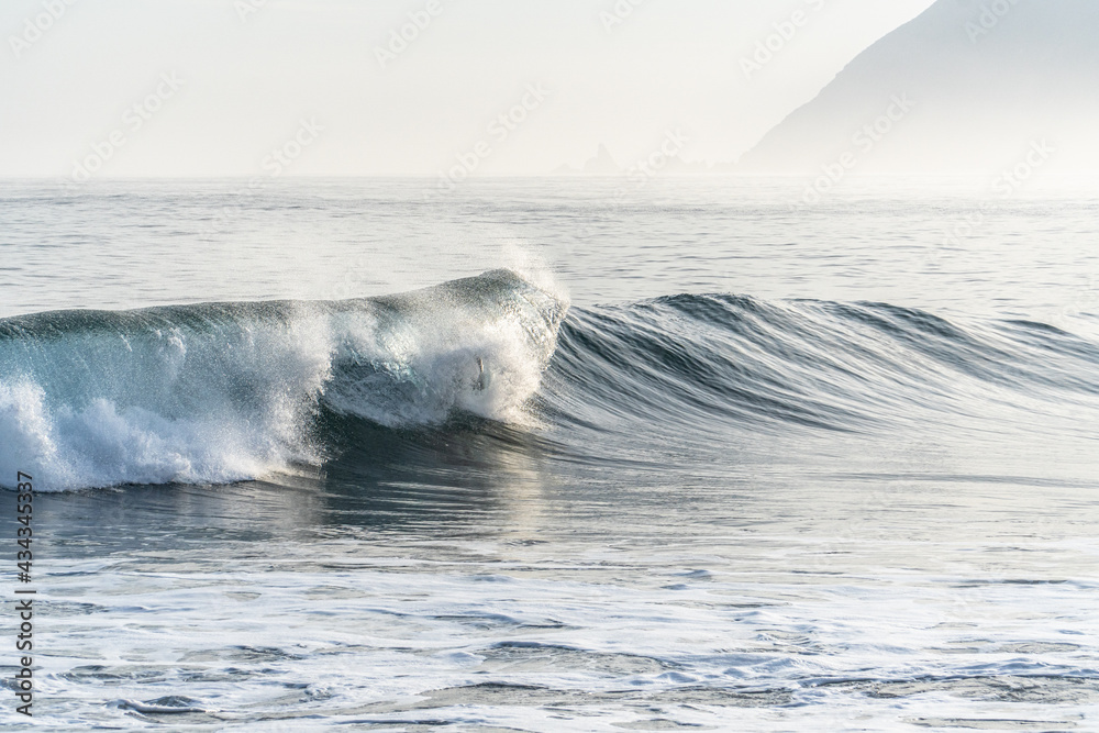 beautiful colorful wave at sunrise in chilean west coast puertecillo