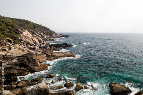 The clear water and the rocks on the shore